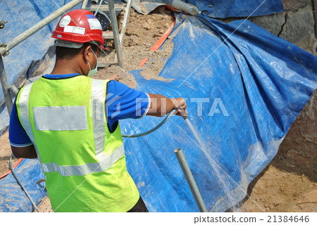 Spraying the anti termite chemical treatment Spraying the anti termite chemical treatment 21384646