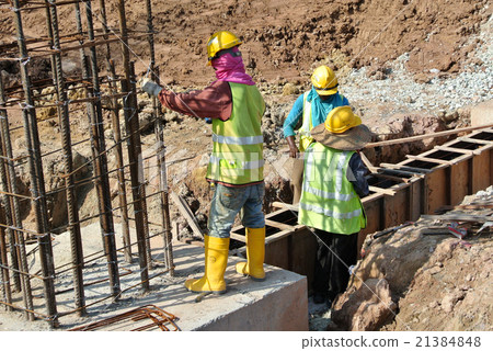 Construction Workers working at construction site Construction Workers working at construction site 21384848