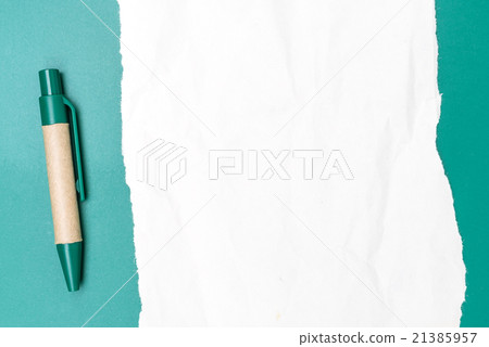 Blank paper crumpled with pen and green background 21385957
