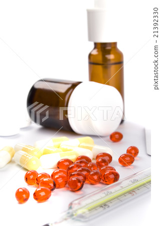 thermometer and different pills 21392330