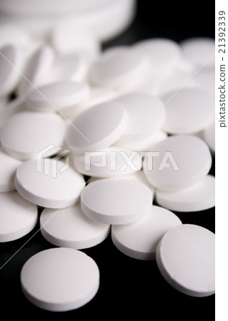 white pills closeup white pills closeup 21392339
