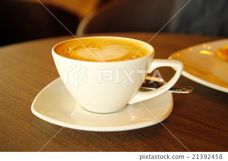 cappuccino hot coffee in white cup on wood table cappuccino hot coffee in white cup on wood table 21392458
