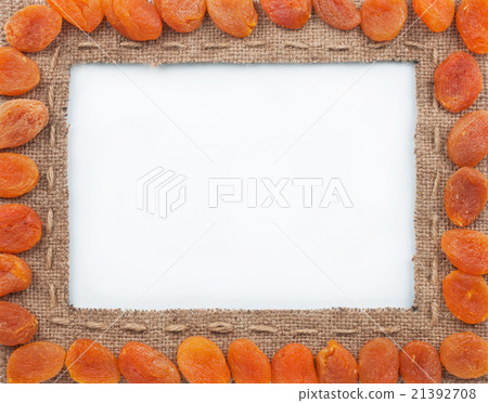 Frame made of burlap with dried apricots 21392708