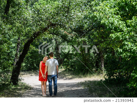 young pretty couple in the green summer park young pretty couple in the green summer park 21393941