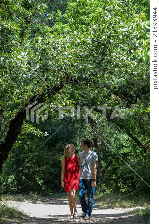 young pretty couple in the green summer park young pretty couple in the green summer park 21393944