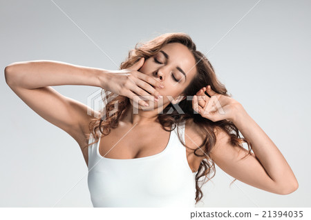 The young woman's portrait with bored emotions The young woman's portrait with bored emotions 21394035