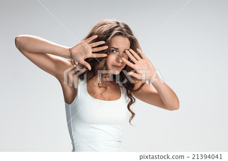 The young woman's portrait with frightened 21394041