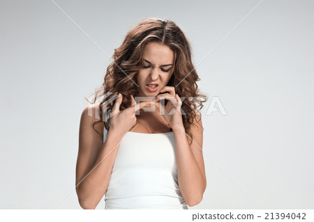 The young woman's portrait with bored emotions The young woman's portrait with bored emotions 21394042