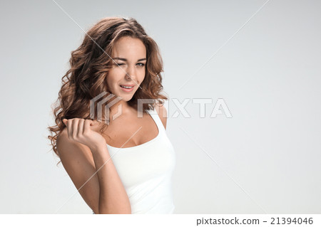 The young woman's portrait with happy emotions The young woman's portrait with happy emotions 21394046