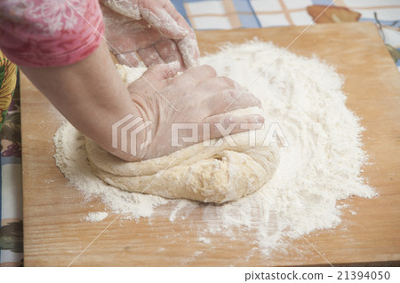Women's hands preparing fresh yeast dough Women's hands preparing fresh yeast dough 21394050
