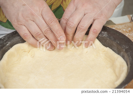 Raw dough in black metal baking form Raw dough in black metal baking form 21394054