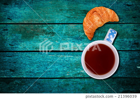 croissant with the tea on table croissant with the tea on table 21396039