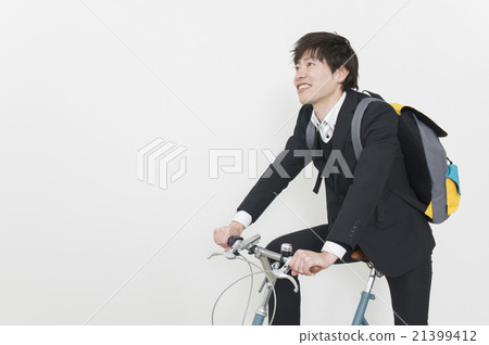 A businessman going to work by bicycle 21399412