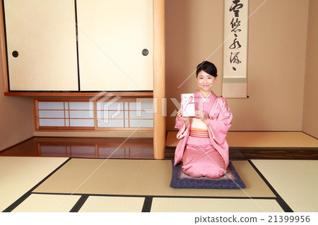 A woman holding a gift bag 21399956