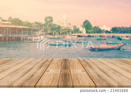 Wooden board empty table blur boat in port Wooden board empty table blur boat in port 21401889