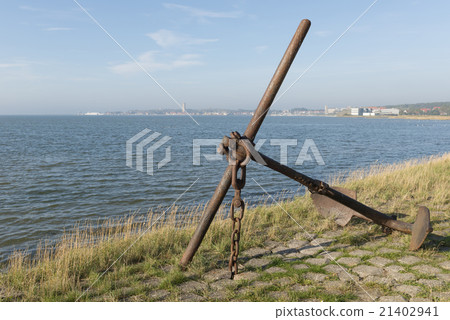 Old rusted anchor on an island. 21402941