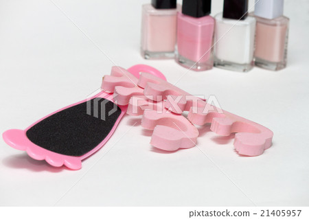 Pedicure accessories, pink nail polish on white Pedicure accessories, pink nail polish on white 21405957