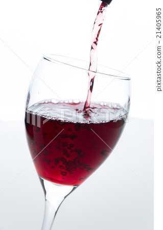 Red wine poured into a wine glass Red wine poured into a wine glass 21405965