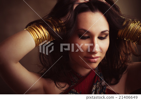 Indian woman with gold bracelets on hands 21406649