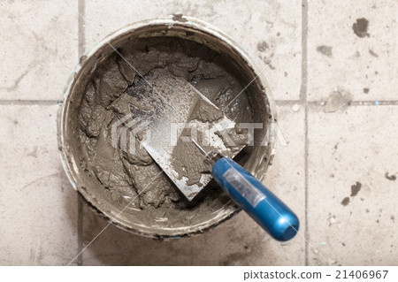 bucket with cement and trowel bucket with cement and trowel 21406967