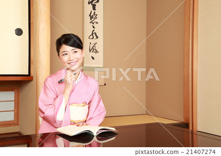Kimono women writing in the notebook Kimono women writing in the notebook 21407274