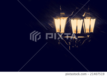 Street lamps in snowfall close up photo. Tinted Street lamps in snowfall close up photo. Tinted 21407519