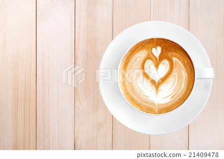 Top view latte art coffee on wood background Top view latte art coffee on wood background 21409478
