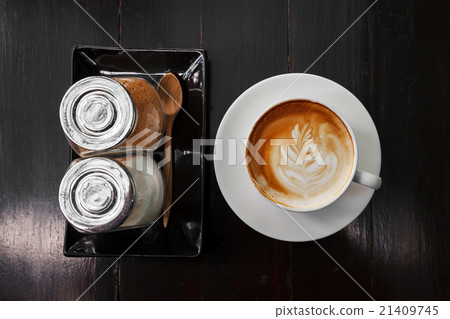 Cup of latte coffee and sugar on wooden Cup of latte coffee and sugar on wooden 21409745