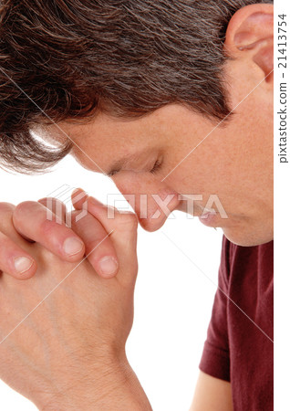 Close up of praying young man. Close up of praying young man. 21413754