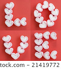 Arrange pink heart marshmallows as LOVE word 21419772