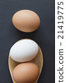 White and brown eggs in wooden ladle flat lay 21419775