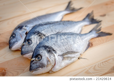 Cooking fish on the grill 21420614