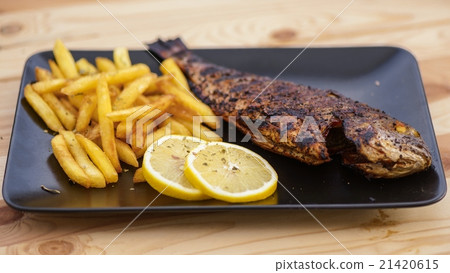 Cooking fish on the grill 21420615