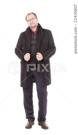 Men in a black coat. 21420807