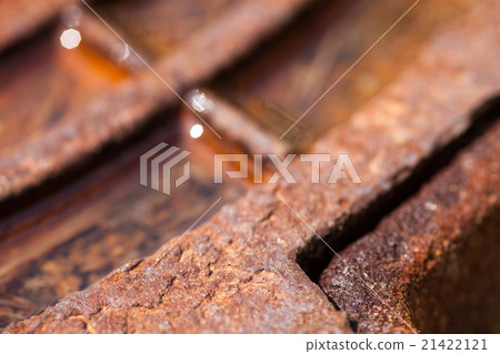 Close up of the rusty metal manhole cover 21422121