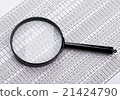 Magnifying glass lies on the statement printed 21424790