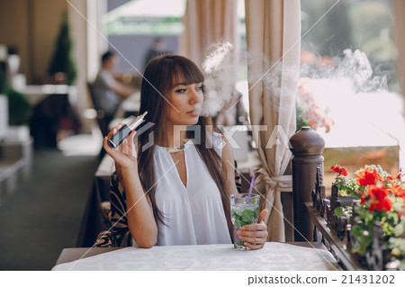 girn in cafe with E-Cigarette girn in cafe with E-Cigarette 21431202
