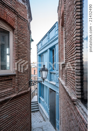 Narrow street and lantern on wall of building Narrow street and lantern on wall of building 21432490