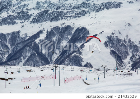 blue skies with clouds over the mountains in snow 21432529