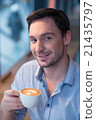 Content man drinking coffee 21435797