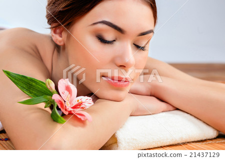 Beautiful young woman at a spa salon Beautiful young woman at a spa salon 21437129