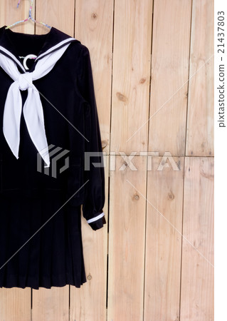 School clothes for girl on wood background 21437803