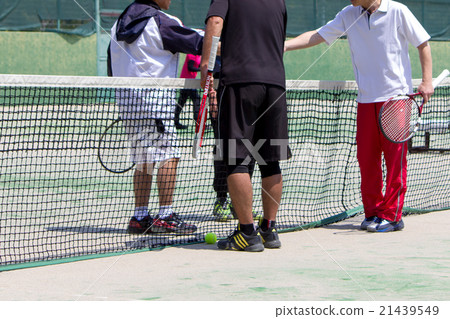 A woman playing tennis A woman playing tennis 21439549