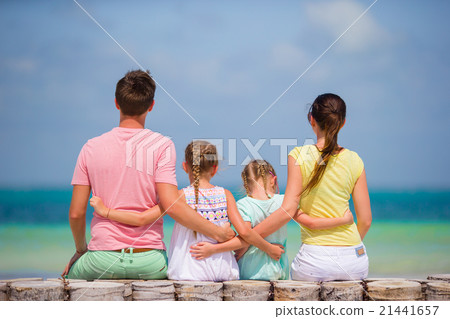 Young family of four on beach vacation Young family of four on beach vacation 21441657