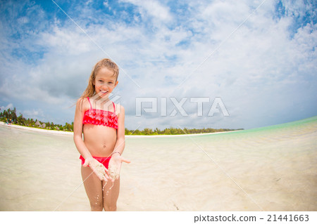 Adorable little girl at beach during summer Adorable little girl at beach during summer 21441663