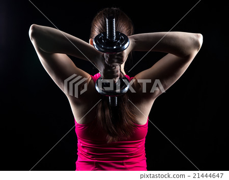 Athlete with kettlebell behind the head Athlete with kettlebell behind the head 21444647
