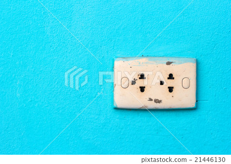 Old power outlet on green background Old power outlet on green background 21446130
