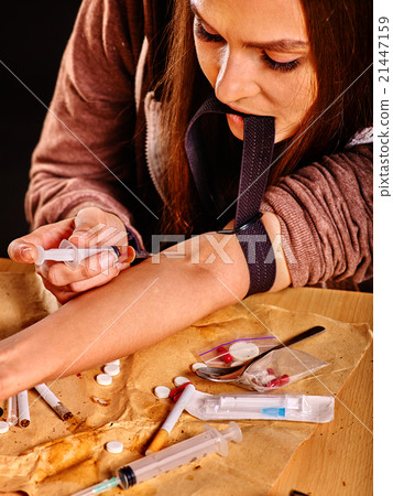 Female drug addict with syringe. Female drug addict with syringe. 21447159