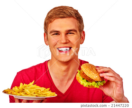 Man eating big sandwich and fried potatoes. 21447220