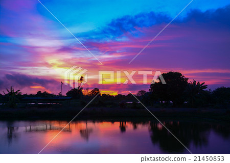 twilight clouds over the fish pond in Thailand 21450853